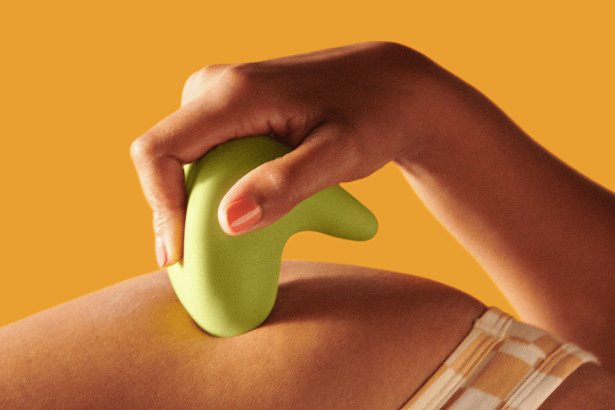 A person's  hand using Kiwi to massage their hip